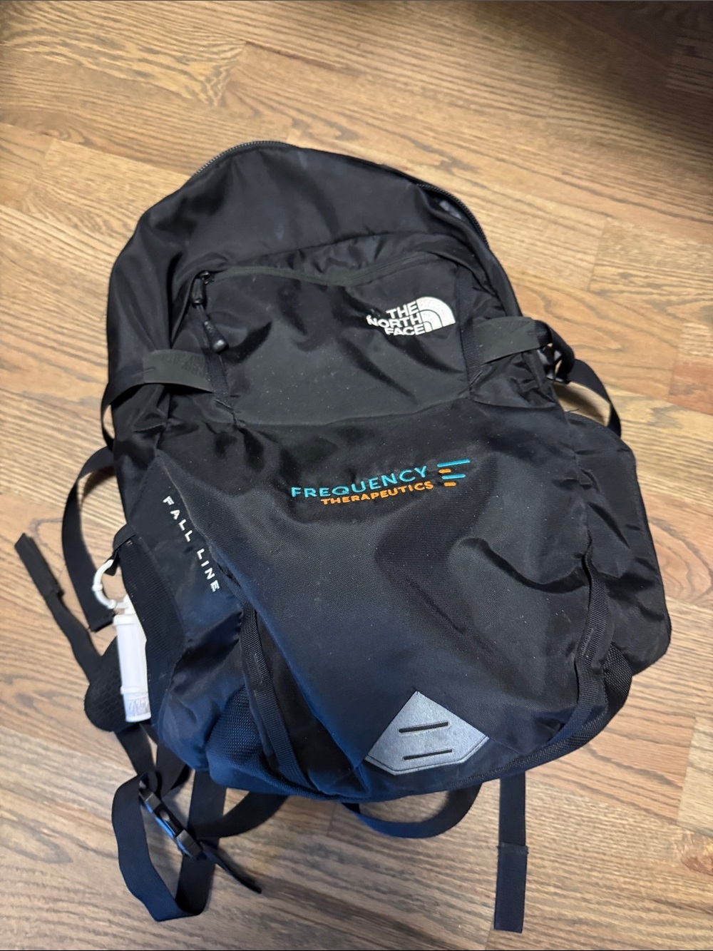 The North Face Black Backpack with Blue & Orange Frequency Logo